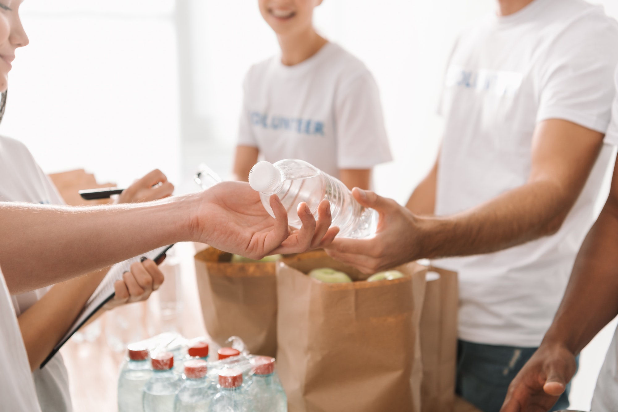 cropped-shot-of-volunteers-with-food-and-drinks-for-charity.jpg